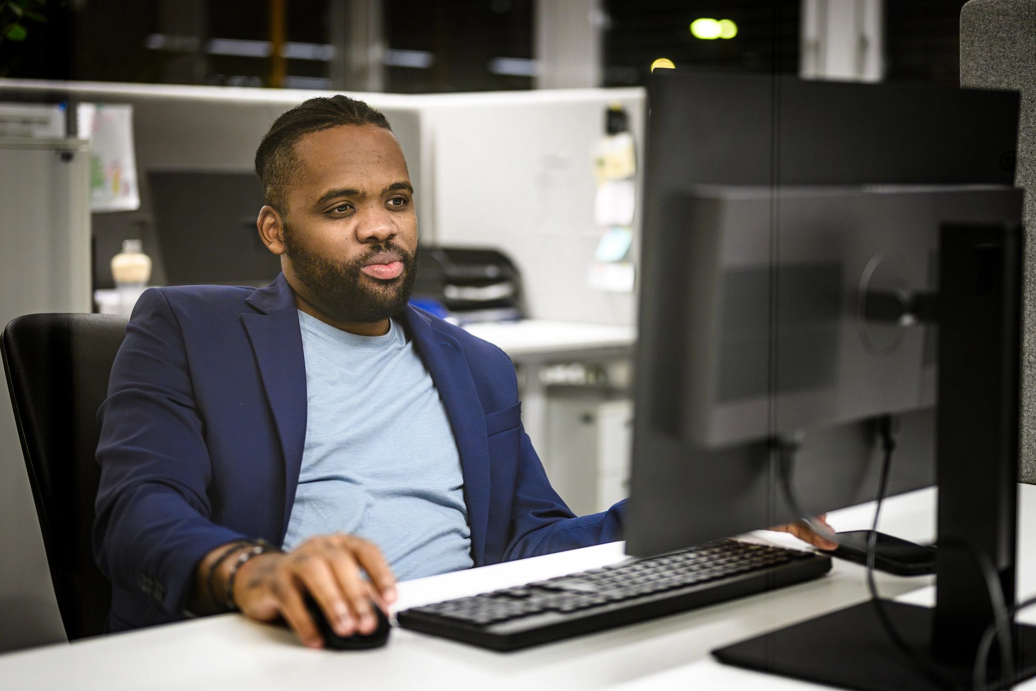 Journalist working at a computer desk